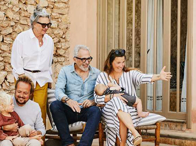 family sitting on patio