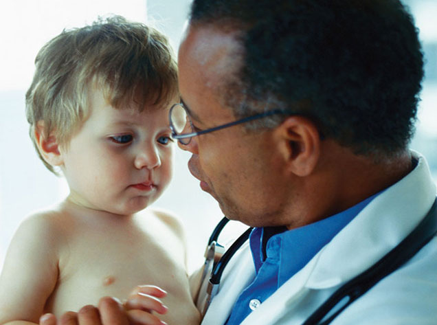 doctor holding baby