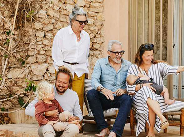 family sitting on a patio