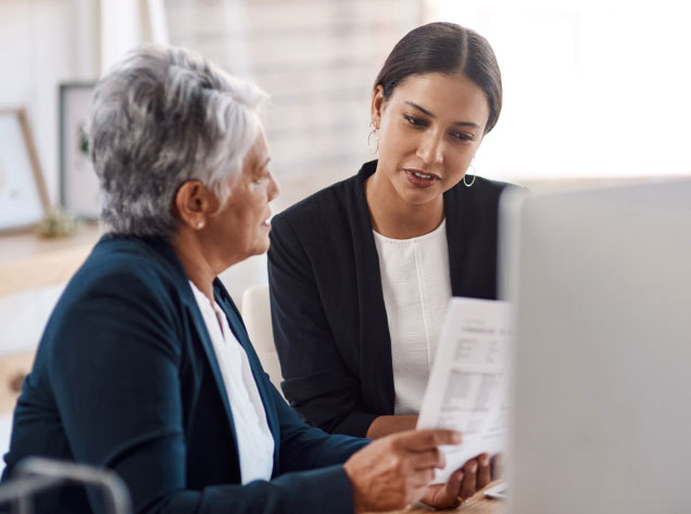 Ladies discussing life settlements and structured settlements.
