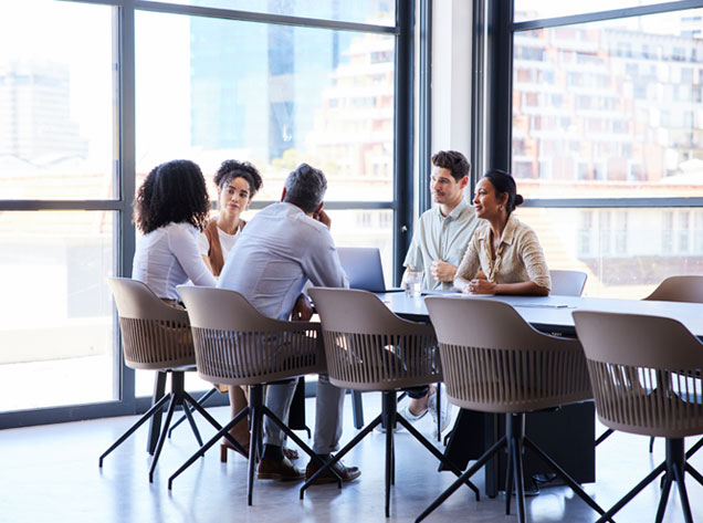 employees meeting at conference table