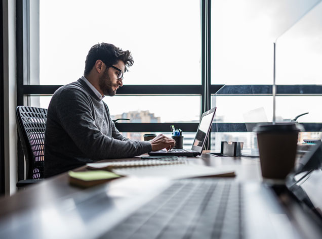 man at desk in office