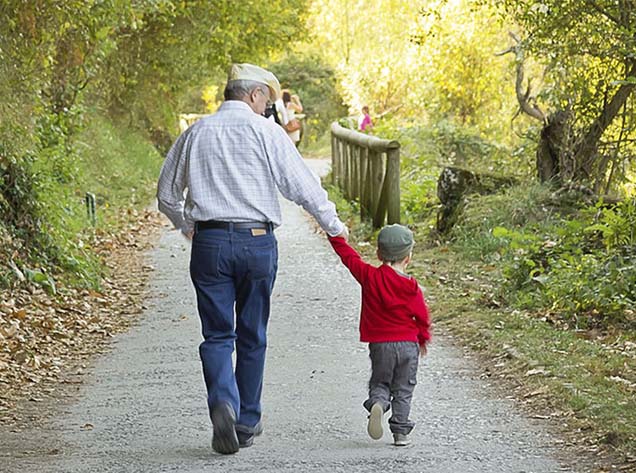 man and boy holding hands
