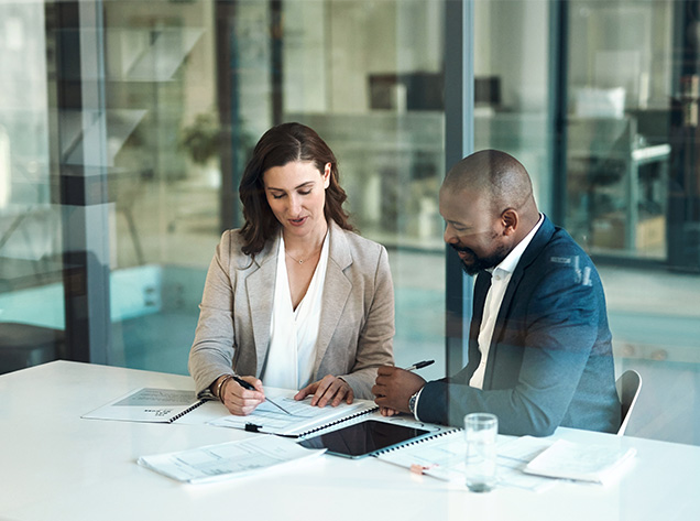 man and woman reviewing documents